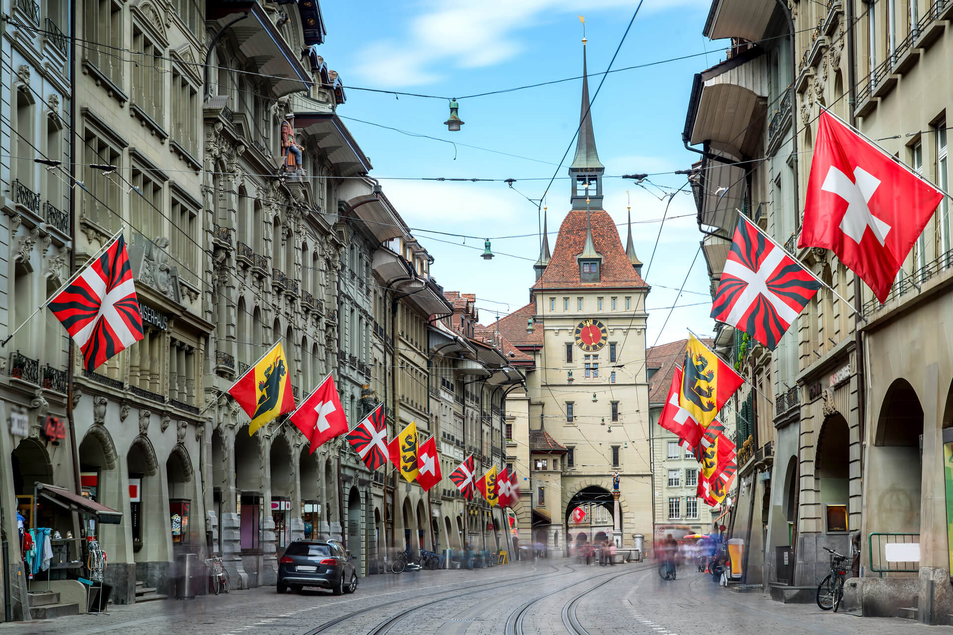 Shopping alley with the famous clocktower of Bern in Switzerland